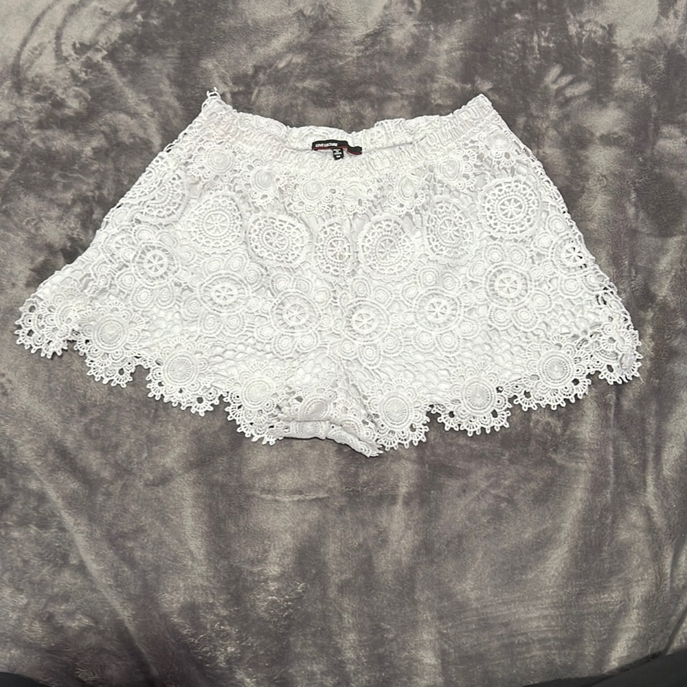 Love Culture: White shorts with pattern in size Medium.
